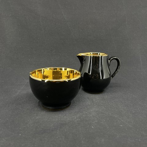 Black Confetti with gold creamer and sugar bowl