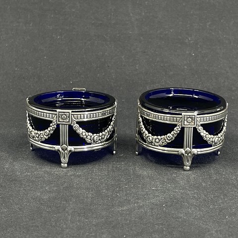 A pair of Swedish candle holders with silver