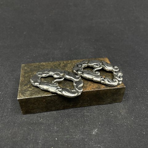 A pair of silver shoe buckles