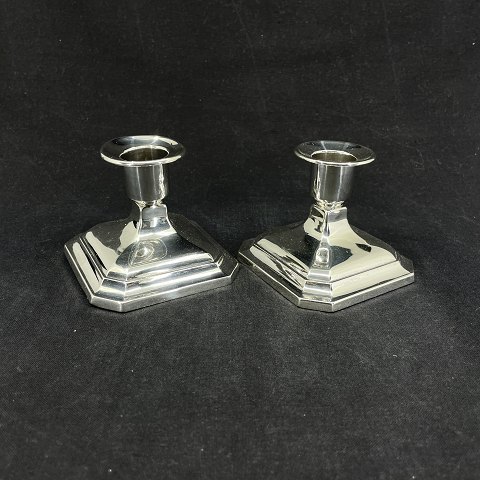 A pair of candlesticks in silver